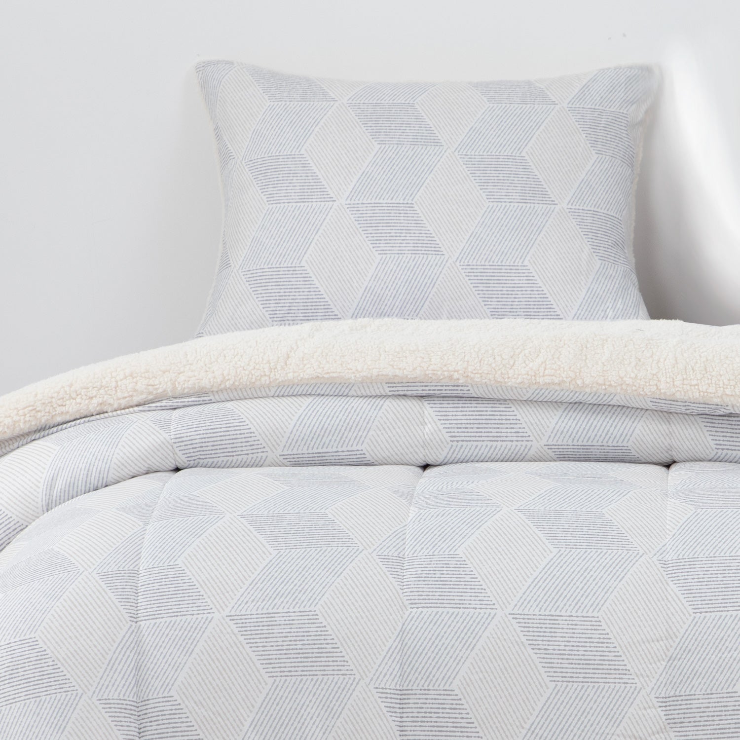 Plumon  Reversible Sherpa 1.5 Plaza Block. Gris DIB