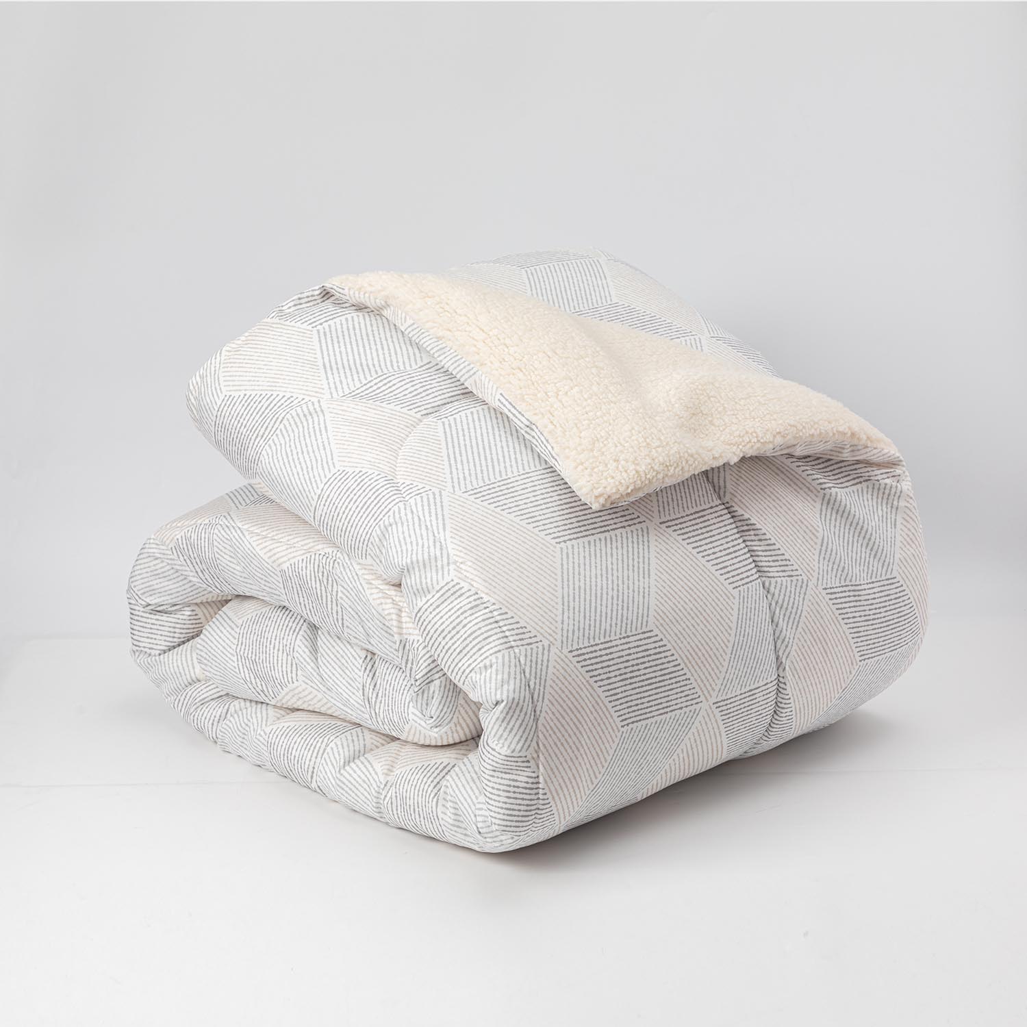 Plumon  Reversible Sherpa 1.5 Plaza Block. Gris DIB