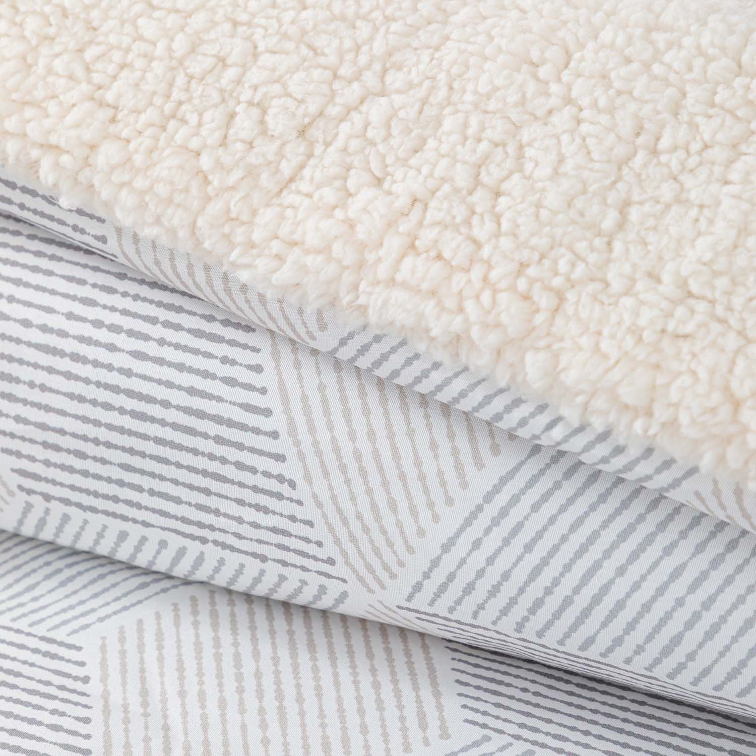 Plumon  Reversible Sherpa 1.5 Plaza Block. Gris DIB